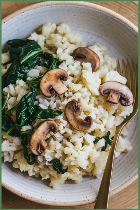 Bowl of rice with sautéed mushrooms and spinach, garnished with a fork. Mushroom Spinach Cauliflower Rice Recipe, Riced Cauliflower Recipes, Rice With Spinach, Keto Rice, Cauliflower Rice Risotto, Coconut Cauliflower Rice, Cauliflower Rice Easy, Spinach And Mushrooms, Cheesy Broccoli Casserole