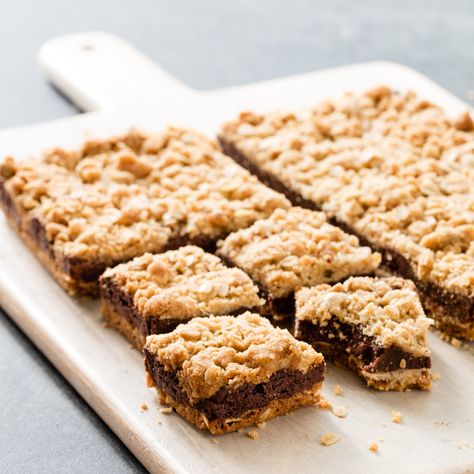 A chewy crust, dense filling, and crunchy topping give this bar a nice contrast of textures. Revel Bars Recipe, Chocolate Revel Bars, Oatmeal Fudge, Revel Bars, Oatmeal Crumble Topping, Oatmeal Fudge Bars, Holiday Recipies, Streusel Bars, Cooks Country