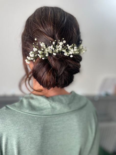 Bridesmaid low textured updo with flowers Loose Bun With Flowers, Low Updo Wedding Hair With Flowers, Hair Bun Indian Style, Wedding Low Bun With Hairpiece, Low Bun Wedding Hair Flowers, Low Bun Hairstyles With Flowers, Low Bun With Flowers Indian, Indian Hairdo With Flowers, Low Messy Bun Wedding Hair Indian