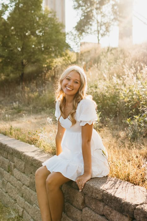 blonde girl in a white dress in a field during golden hour Field Senior Pictures, Senior Pictures Dresses, Senior Pic Poses, Outdoor Senior Pictures, Cute Senior Pictures, Senior Pic Inspo, Senior Photoshoot Poses, Summer Senior Pictures, College Senior Pictures