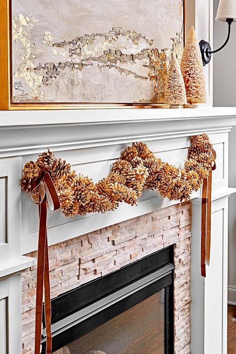 fireplace-pinecone-decoration-d53f0e2f Decorating With Pinecones, Pine Cone Christmas Decorations, Holiday Decorating Ideas, Classic Holiday Decor, Winter Door Decorations, Pinecone Garland, Painted Pinecones, Winter Wreath Diy, Cone Crafts