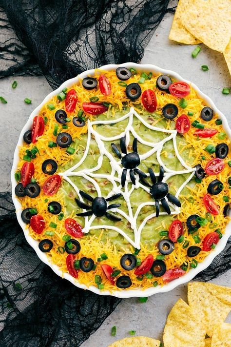 13 Easy Scary Halloween Appetizer Recipes for Your Potluck | Brit + Co Halloween Appetizers For Adults, Halloween Themed Appetizers, Halloween Potluck, Halloween Appetizers Easy, 7 Layer Dip, Halloween Pizza, Halloween Party Appetizers, Halloween Food Appetizers, Appetizers For Kids