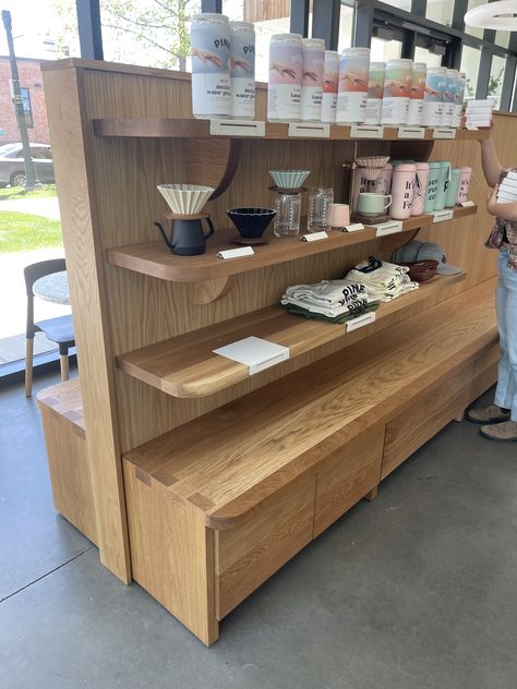 Pine Coffee Supply in Boise, ID retail merchandise display with storage cabinets one one side and bench for seating on the other. Built by Iron Timber Custom Furniture in Boise, ID Coffee Shop Merchandise Display, Coffee Shop Shelves, Merchandise Display, Lower Cabinets, Coffee Supplies, Oak Shelves, Low Cabinet, Built In Bench, Boise Idaho