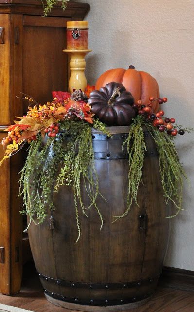 Whiskey Barrel Halloween Decor, Fall Front Porch Decor Wine Barrel, Fall Barrel Decor, Wine Barrel Porch Decor, Fall Whiskey Barrel Ideas, Fall Barrel Planter Ideas, Butter Churn Decor Ideas, Wine Barrel Garden, Whiskey Barrel Decor