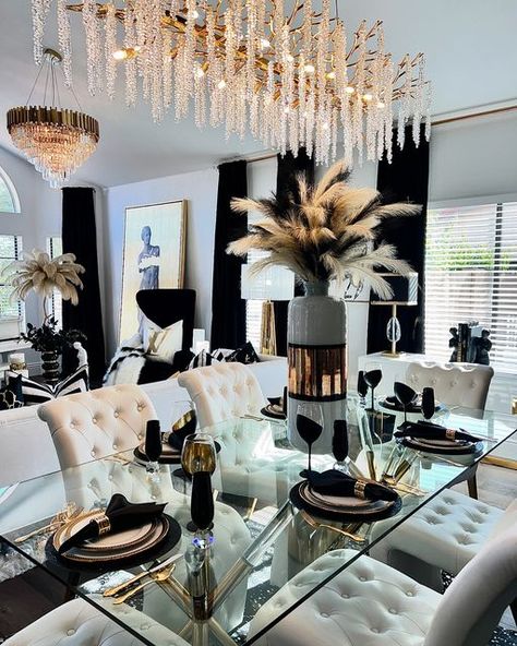 Wendy Millward on Instagram: "Happy Tuesday My Friends! Today I am featuring my living room and dining room in black, white, and gold! I love bold colors but this is currently my favorite color combination! Which colors would you like to see me post in the future? Please stay tuned for Las Vegas Market inspiration coming up soon! I am attending this amazing market this week! I hope you have a wonderful day!🖤💛🖤 . FOR LINKS FOR MY BEAUTIFUL PILLOW COVERS PLEASE COMMENT “PILLOWS” . . . . #glamdiningroom #glamdecor #glamdecorating #luxuriousdecor #blackandgold #chandeliers #chandelier #glamorousdecor #glamdesign #glamdesigner #gorgeousdecor #classydecor #classyinteriors #diningroomdecor #livingroominspiration #coffeetablestyling #europeandecor #greekstatue #greekstatus #greekkey #decor #pil Silver And Gold Dining Room Decor, Black And White Dining Room Decor Ideas, Black And Gold Dining Room, Glam Apartment Decor, Boujee Apartment, Luxury Dining Room Decor, Dining Room Glam, Luxury Room Design, Glam Dining Room