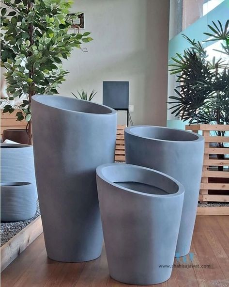 The Abstract Light Grey Vase Shaped FRP Planter With Its Handcrafted Matte Finished Body And Clean Lines Adds A Unique And Minimalistic Touch To Any Spaces. Showcase Your Favorite Plants In Style And Bring A Touch Of Natural Charm To Your Interior. Using Fiberglass Planters In Your Plantscaping Designs Is A Great Way To Enhance The Beauty Of Any Indoor Or Outdoor Landscape. Their Durable, Commercial Grade Construction And Vast Color Choices Make Fiberglass Plant Containers An Interiorscape An... Pots In Landscaping, Large Pots In Landscaping, Grey Vase, Planter Outdoor, Plant Containers, Grey Vases, Large Flower Pots, Fiberglass Planters, Outdoor Landscape