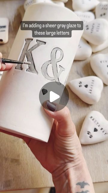 Gitti Lindner- Cinder Ceramics on Instagram: "Here’s part two on glazing stamped images or letters on a ceramic piece. This is done in the bisqueware stage after the first firing. 
The tips are in the video 🖤
.
.
.
#handmade #personalized #customized #ceramics #ceramicist #pottery #clay #smallbatch #handmaker #keramik #ceramic #glazingpottery #glazing" Lettering On Ceramics, Ceramic Letters Ideas, Clay Letters, Pottery Clay, Letter Stamps, Letter Stencils, Painted Letters, Large Letters, Etching