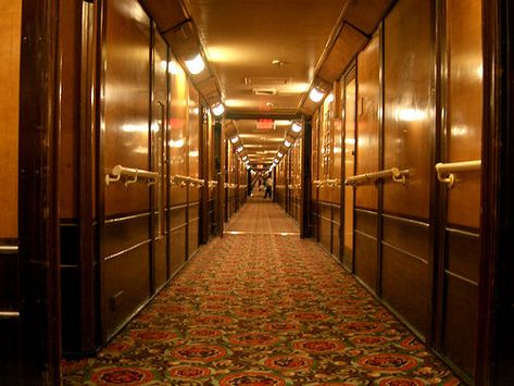 Queen Mary - now a hotel in Long Beach Old Hotel Hallway, Love Hotel Aesthetic, Backroom Levels, Cherry Coloured Funk, Liminal Photography, Long Hallway With Doors, Hallway With Doors, Hotel Corridors, Art Deco Lobby