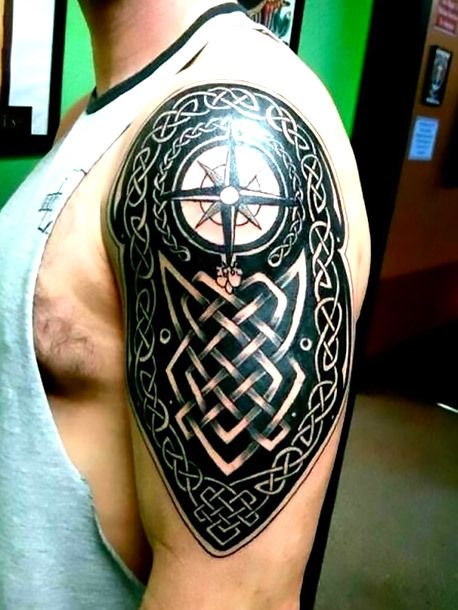 A nice blackwork men tattoo on the shoulder. There is a compass upon the Celtic patterns. Style: Blackwork. Color: Black. Tags: Nice Tattoos Calligraphy, Celtic Warrior Tattoos, Tattoos Owl, Tattoos Feather, Tattoos Celtic, Tattoos Angel, Tattoos Lion, Celtic Tattoos For Men, Tattoos Dotwork