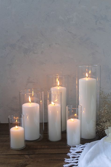 Classic white pillar candles in clear glass candle holder vases are perfect for styling a classic wedding or party. Use as aisle candles, table centrepieces and entry candles. Available in a variety of heights, sizes and colours to suit your event. White Pillar Candles Wedding, Ikea Candle Wedding, Wedding Floor Candles, Candle Holder Table Decor, Long White Candles, Floor Candles Wedding, Pillar Candles Wedding Table, Ikea Candles Wedding, Pillar Candles Wedding Centerpiece