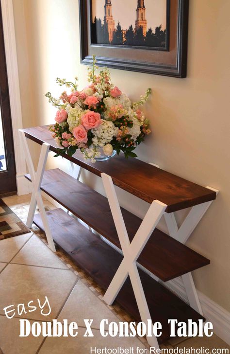 An easy build, DIY Double X console table for your entryway. Build for less than $50 with these free plans. Sleek Console Table, X Console Table, Sleek Console, Table Build, Funky Home Decor, Diy Holz, Easy Home Decor, Cheap Home Decor, Decor Rustic