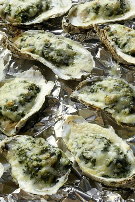 Ina Garten's Easy Oysters Rockefeller is made with fresh oysters, butter, shallots, Pernod liqueur, creamed spinach, Parmesan cheese, and Gruyère cheese. This delicious Oysters Rockefeller recipe creates a tasty appetizer that takes about 23 minutes to prepare and can serve up to 8 people. Oyster Rockefeller Recipe No Shell, Grilled Oysters Rockefeller Recipe, Oyster Rockefeller Recipe, Oysters Rockefeller Recipe, Baked Oyster Recipes, Oyster Rockefeller, Rockefeller Recipe, Spinach Parmesan, Smoked Oysters