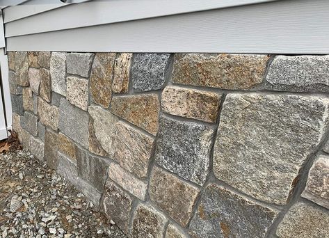 Stone Veneer Exterior Foundation, Stone Veneer Exterior Before And After, Stone Veneer Panels Exterior, Foundation Stone Ideas, Stone Skirting House, Retaining Wall Makeover, Arbor Patio, Diy Stone Veneer, Mountain House Interior