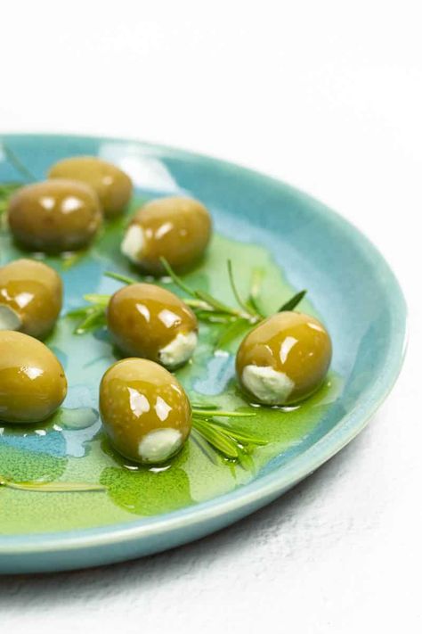 Blue Cheese Stuffed Olives are an easy appetizer, addition to cheese plates and delicious cocktail garnish for martinis and Bloody Marys. Blue Cheese Olives, Top Appetizers, Blue Cheese Stuffed Olives, Pickle Appetizers, Stuffed Olives, Cheesy Appetizer, Cheese Plates, Olive Recipes, Pickled Garlic