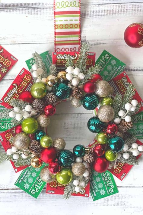 Deck the halls this holiday season with this DIY NJ Lottery ticket Christmas wreath. This unique ornament wreath is a great gift idea for friends and family too. What a perfect way to share some luck this holiday season. Lottery Wreath Ideas, Lotto Ticket Wreath, Gift Card Wreath Ideas Easy Diy, Lottery Ticket Wreath Diy, Christmas Lottery Ticket Gift Ideas, Lottery Ticket Wreath, Gift Card Wreath, Lottery Ticket Christmas Gift, Lottery Ticket Gift Ideas