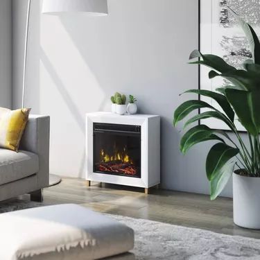 The Complete Guide to Portable Electric Fireplaces | Hunker Mantel Electric Fireplace, Small Electric Fireplace, Portable Electric Fireplace, White Electric Fireplace, Freestanding Stove, Mantel Surround, Electric Fireplace Heater, Fireplace Heater, Electric Fireplace Insert