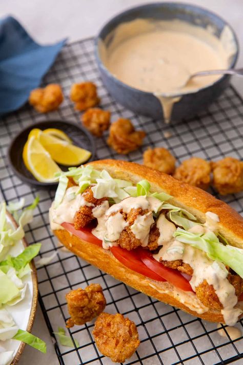 Shrimp Po' Boy Sandwich Served with Remoulade Sauce Shrimp Po Boys Recipe, Shrimp Poboys Recipe, Easy Shrimp Poboy Sandwich, Shrimp Poboy Sandwich Sauce, Poorboy Sandwich Recipe, Poboy Shrimp Sandwich, Fish Poboy Sandwich, Shrimp Poor Boy Sandwich Recipes, Fried Shrimp Poboy Sandwich