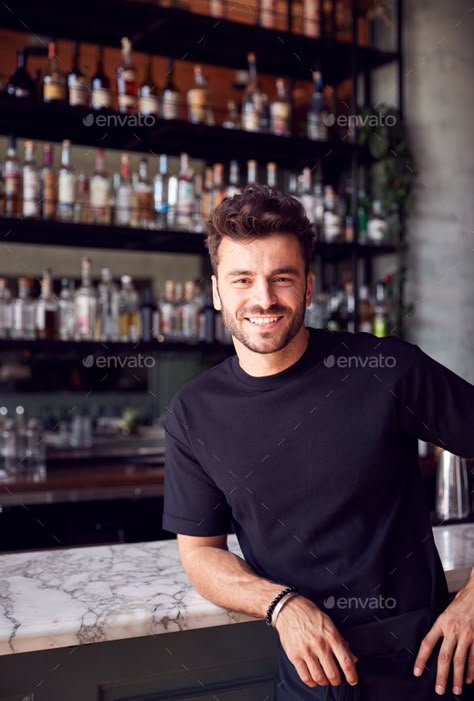 Leaning On Bar Pose, Leaning Against Counter Pose, Bar Photoshoot Ideas Men, Bar Portrait Photography, Leaning On Counter Pose, Restaurant Portrait, Mens Bar Photoshoot, Male Bartender, Bar Owner