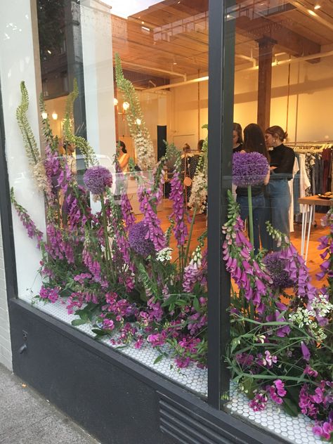 Store window brought to life with floral installation by By Kay Studio. Inspired by the wild sweet pea and foxglove growing everywhere in Oregon Easter Store Window Display, Florist Window Display, Spring Window Display, Diy Christmas Garland, Floral Installation, Garden Window, Store Window Display, Spring Window, Flower Window