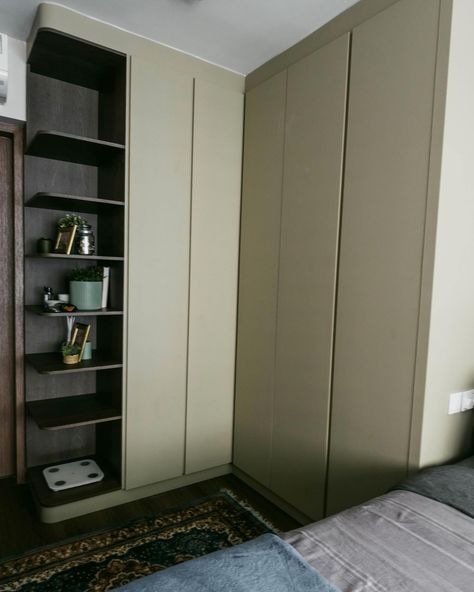 An L-shaped wardrobe can be a smart choice for a HDB BTO master bedroom primarily, for optimising space utilisation: L-shaped wardrobes are designed to maximize corner spaces efficiently, making them ideal for rooms with limited space like HDB bedrooms. By incorporating curved shelves facing the room entrance, we can create a more inviting and harmonious flow in the carpentry design. This also allows us to seamlessly extend the aesthetic of the wood laminate chosen for the living area into t... L Shaped Wardrobe, L Shape Wardrobe Design, L Shape Wardrobe, Curved Shelves, Corner Space, Room Entrance, Optimize Space, Wardrobe Design, Wood Laminate