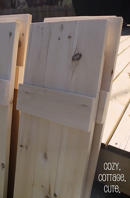 DIY shutters- I have been eyeballing these shutters on other folk's houses & planning to build them. Looks like that just got easier! Stain Shutters Exterior, Green Siding Door Color Ideas, Homemade Shutters For Windows, Diy Board And Batten Shutters Exterior, Homemade Shutters, House With Shutters, Cottage Shutters, Shutter Dogs, Farmhouse Shutters