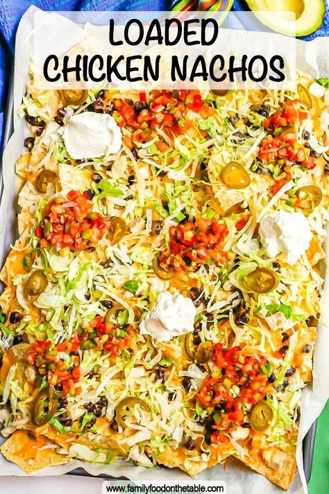 Loaded chicken nachos with black beans and plenty of cheese are made in a double layer to ensure tons of good stuff on every chip. Add ALL your favorite toppings and dig in! Shredded Chicken Nachos Easy, Loaded Nachos Recipe Chicken, Baked Chicken Nachos, Loaded Chicken Nachos Recipe, Loaded Chicken Nachos, Shredded Chicken Nachos, Loaded Nachos Recipe, Ultimate Nachos, Mexican Nachos