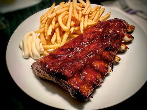 Home made grilled baby back ribs with spicy smoked burbon BBQ sauce and fresh made crispy garlic truffle fries Chicken Bacon Ranch Quesadilla Recipe, Ribs And Fries, Grilled Pork Ribs, Grilled Baby Back Ribs, Pork Ribs Grilled, Crispy Garlic, Quesadilla Recipe, Truffle Fries, Back Ribs