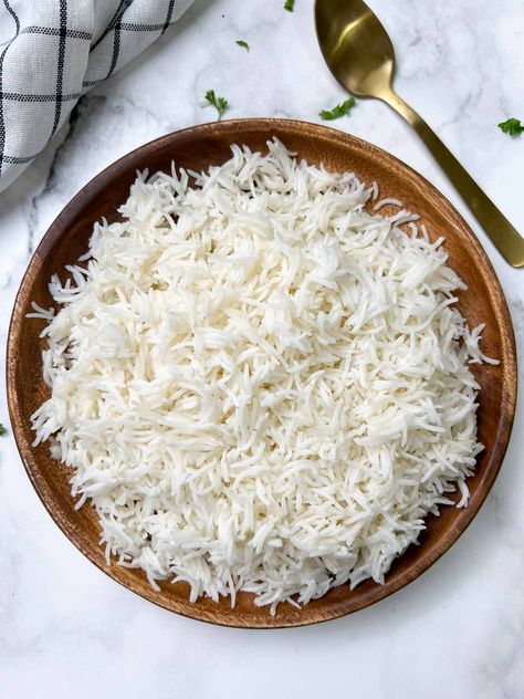 cooked white basmati rice on a plate with spoon on the side Basmati Rice In Instant Pot, Instant Pot Basmati Rice, Rice In Instant Pot, White Basmati Rice, How To Reheat Rice, Basmati Rice Recipes, White Rice Recipes, Poached Chicken, Veggie Delight