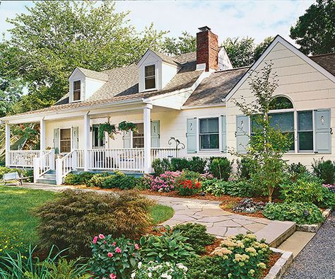 The expansive front porch offers a spot for resting and serves as a connection between the house and landscape:http://www.bhg.com/home-improvement/porch/porch/before-and-after-porch-makeovers/?socsrc=bhgpin041514awelcomefrontporch&page=7 White House With Blue Shutters, Cape Cod Exterior, Cape Cod House Exterior, Front Porch Addition, Porch Landscaping, Porch Remodel, Cape Cod Style House, Porch Addition, Blue Shutters