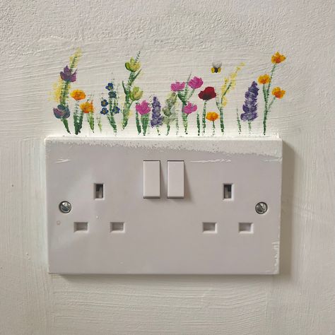 Infp Room Decor, Painting Around Switchboard, Wall Outlet Painting, Lightswitch Painting, Lightswitch Ideas Painting Cute, Dresser Painting Ideas Creative, Switchboard Painting, Light Switch Flowers, Library Artwork