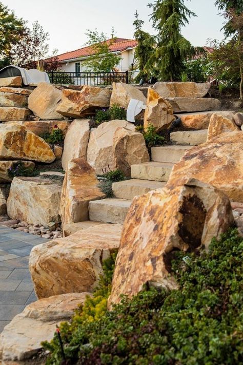 When you choose Big Rock Landscaping for your rock wall installation, you are choosing an arsenal of ideas and expertise that make your life easier and your yard more beautiful. Between our years of experience and passion for stunning landscape, we bring landscaping to life when we plan your outdoor space. Large Stones In Landscaping, Large Rock Wall Landscaping, Landscape Large Rocks, Natural Rock Retaining Wall Landscapes, Large Boulder Retaining Wall, Retaining Wall Large Stones, Rock Wall Landscape, Rock Wall Gardens, Yard Wall