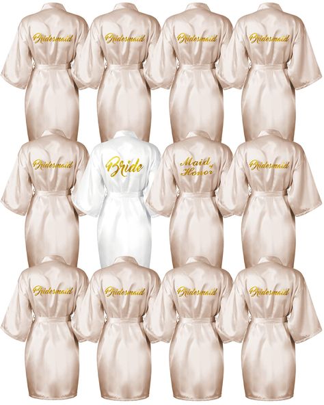 PRICES MAY VARY. Complete Set: our 12 pieces robe set includes 1 white bridal robe, 1 chief bridesmaid robe, and 10 bridesmaids robes; Nice for any wedding party Elegant Design: our robes feature a beautiful kimono style design with a low neckline and belt, and are adorned with eye catching gold glitter; Plus, the words "Bride," "Maid of Honor," and "Bridesmaid" are printed on the back Comfortable Material: made from lightweight, breathable polyester, our robes are soft to the touch and won't wr Bridesmaid And Bride Robes, White And Gold Wedding Theme Bridesmaid, Blush And Champagne Wedding Colors, Vintage Bachelorette Party, Champagne Bridal Party, Wedding Prizes, Maid Of Honor And Bridesmaid, Bride And Bridesmaid Robes, 10 Bridesmaids