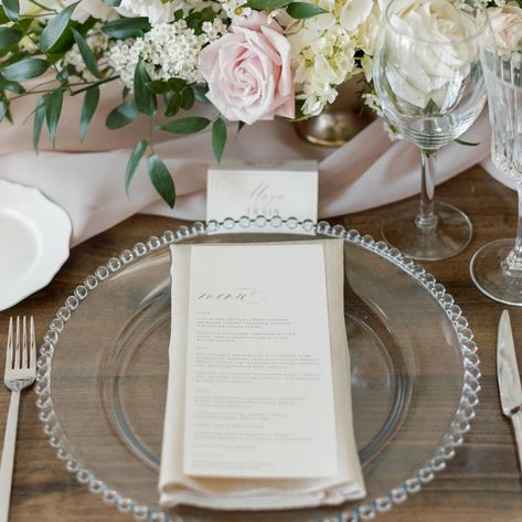 A springtime table setting is always beautiful. 🌷Click through to rent our Clear Glass Bead Chargers for your event.   Planner: @weddingsbyalexandria   #weddingcharger #tablesettingideas #clearcharger #glasscharger #dinnermenueideas #eventmenu #menucalligraphy #stationerydesign #eventstationery #tablescapeinspiration #pinktablescape #pinktablesetting #rustictablesetting #simpletablesetting Wedding Plate Set Up, Pink Table Settings, Silver Charger Plates, Pink Tablescape, Romantic Table Setting, Rustic Table Setting, Simple Table Settings, Event Menu, Romantic Table