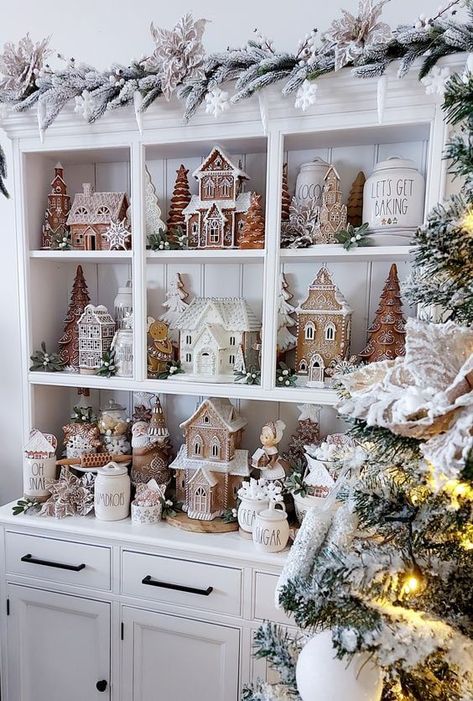 Get ready to step into a scrumptious holiday wonderland with my 30 Gingerbread Christmas decor ideas! From simple touches to grand statements, these ideas will fill your home with festive cheer and sweet, cozy vibes. Grab a hot cocoa, and start discovering your next holiday inspiration! Neutral Christmas Village Display, Christmas Rae Dunn Hutch, Village Houses Christmas, White Christmas Tree Gingerbread Theme, Neutral Christmas Village, Neutral Gingerbread Display, Rustic Gingerbread Decor, Vintage Gingerbread Decor, Rae Dunn Gingerbread