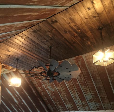 Rustic barn tin ceiling with windmill ceiling fan Rustic Tin Ceilings, Rustic Remodel, Windmill Ceiling Fan, Rustic Ceiling Lights, Rustic Ceiling Fan, Barn Tin, Rustic Ceiling, Ceiling Ideas, Ceiling Light Design