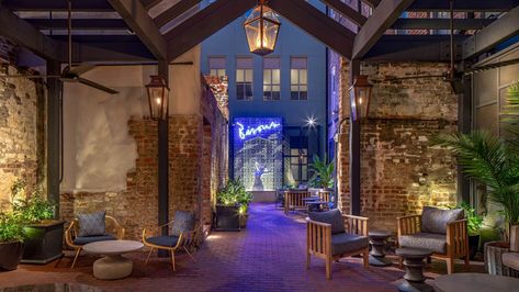 Open air courtyard with vibrant lighting and exposed brick walls. Jane Hotel, New Orleans Hotels, Eliza Jane, New Orleans French Quarter, The French Quarter, Garden District, Exposed Brick Walls, French Bistro, French Quarter