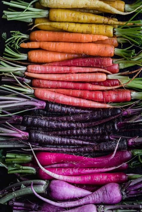 Easy-to-make oven roasted rainbow carrots! The high heat intensifies the carrot flavor and caramelizes the edges as they roast, bringing out their natural sweetness. #rainbowcarrots #roastedcarrots #carrots Honey Carrots, Side Dishes For Ham, Roasted Rainbow Carrots, Carrots Side Dish, Burger Side Dishes, Side Dishes For Salmon, Colorful Carrots, Roasted Carrots Recipe, Rainbow Carrots