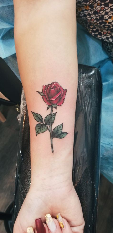 Rose Tattoo Wrapped Around Wrist, Red Rose Wrist Tattoo, Small Red Rose Tattoos For Women, Red Rose Vine Tattoo, Red Rose With Stem Tattoo, Red Rose Arm Tattoos For Women, Green Day Tattoo, Ruby Tattoo, Rose Tattoo On Side