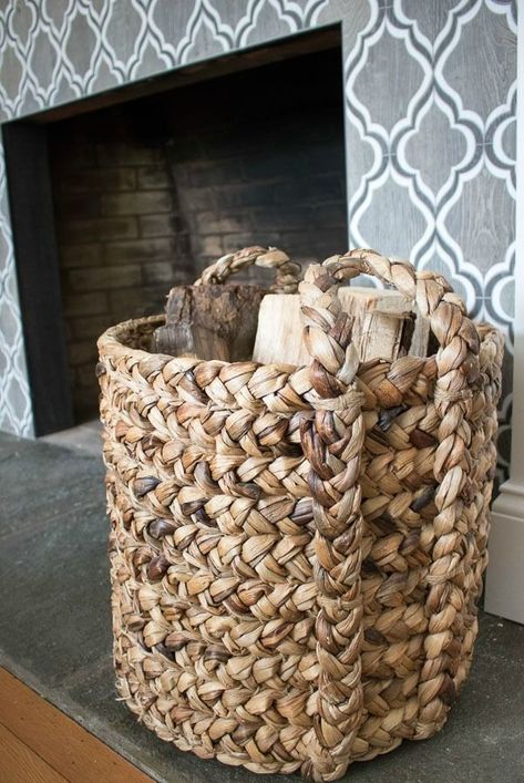 A large woven basket used to store extra firewood by the fireplace - love! #basket #baskets #fireplace #fireplaces Fireplace Hearth Decor, Bohemian Farmhouse Decor, Basket Decor Ideas, Decorate With Baskets, Firewood Basket, Fireplace Baskets, Large Woven Basket, Driven By Decor, Basket Decor