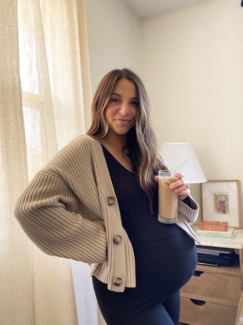 Maternity outfit ideas, pregnancy fashion, iced coffee at home Bump Fall Outfits, Maternity One Piece Jumpsuit, Button Up Maternity Outfit, Maturity Fall Outfits, Cardigan Maternity Outfits, Autumn Outfits For Pregnant Women, Pregnant Cardigan Outfit, Ob Appointment Outfit, Maternity Unitard Outfit