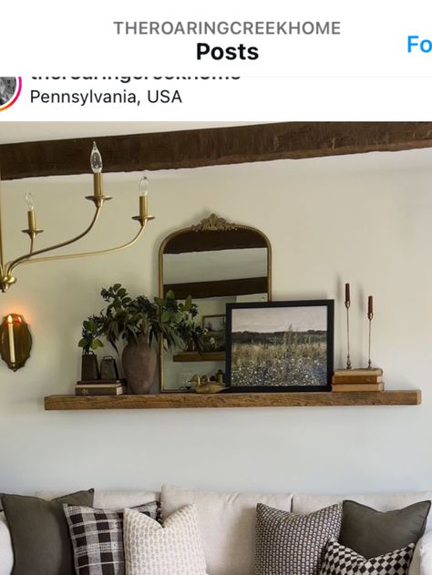 Gallery Wall On Shelf, Small Shelf Above Couch, Long Wall Decorating Ideas Behind Couch, Behind Couch Corner Decor, Floating Shelves Above Couch Living Room, Large Shelf Above Couch, Picture Ledge Ideas Large Wall, Picture Ledge With Hooks, Shelf Decor Living Room Above Couch