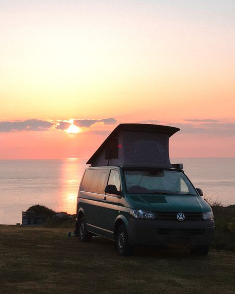 Vw green t5 van wild camping on a hill with the sea and sunset in the distance. The sunset has pink tones and the scene is very tranquil. Sea And Sunset, Beach Landscapes, Wild Camping, Camping Adventure, Vw Campervan, Van Camping, Vw T5, Pink Sunset, Beach Camping