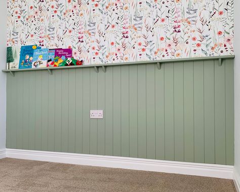 A big thank you to Ann for sharing this gorgeous photo of her nursery makeover, featuring our V-groove panelling kit and a custom picture shelf. 💚 We cut everything to the exact dimensions of her wall, making installation a breeze! The soft green paint and floral wallpaper combo is just dreamy 🌿🌸—perfect for creating a cosy and stylish space. Panelled Playroom, Wall Half Paneling, Half Wall Panelling With Shelf, Nursery Panelling Wall, Nursery Paneling, Panelling With Shelf, Half Paneled Walls, Half Wall Panelling, Green Panelling