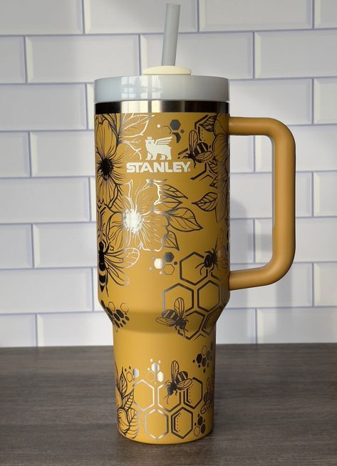 40oz Stanley Cup with a bumble bee and flower design Design. The one in the image is laser engraved on a Yarrow Quencher. The Non-Branded Cups are not Stanley Cups but they do look very similar. Some people call them Dupes.  Take your Stanley Tumbler to the next level with a one-of-a-kind laser-engraved sea-themed design. The design features several fish and sea turtles swimming under the sea. If you would like to see other designs please reach out and we would love to help you! Stanley cups are difficult to purchase at this moment. Due to this we will only sell cups that I can purchase. If you do have a color that you are looking for I have some resources to help me find them. Please reach out to me and I will see what I can do. Comes with a straw Sip with ease and reduce the risk of spil Stanley Laser Design, Custom Stanley Cup, Bee Kitchen Theme, Stanley Cup Aesthetic, Bee Items, Turtles Swimming, Stanley Accessories, Bee And Flower, Stanley Cups