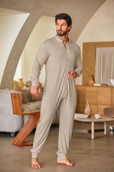 This one-piece thermal union suit is made to adapt to environmental temperature changes so that you may be comfortable all day. Onesie with long sleeves and a crew collar made of double-layer thermal material. Full-button closure. Easy to put on and take off with a button-up front. #men #onesies #thermal Union Suit Men, Long Johns Pajamas, Union Suit, Mens Thermals, Long John, Long Johns, Suit Men, One Piece Pajamas, Men Fashion