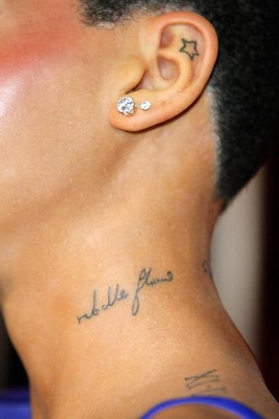 21 Beautiful Rihanna Tattoos With Meaning (2021) - TattoosBoyGirl Rhianna Tattoos, Tattoo Rihanna, Shhh Tattoo, Rihanna Hand Tattoo, Inner Ear Tattoo, Rihanna Tattoo, Small Cross Tattoo, Rihanna Fan, Rihanna Love