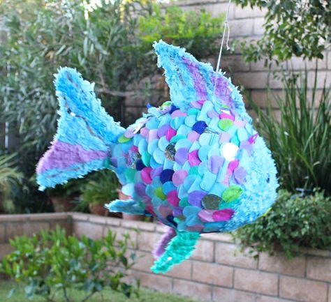 My Rainbow Fish pinata.  I was so sad to see it go.  We always have a great time making them.  My mom and I used a huge balloon and tons on tissue paper.  We had an under the sea themed party for my 3 year old. Fish Pinata, Sea Party Ideas, Birthday Pinata, Piñata Ideas, Diy Pinata, Pinata Party, Fishing Party, Ocean Party, Sea Birthday Party