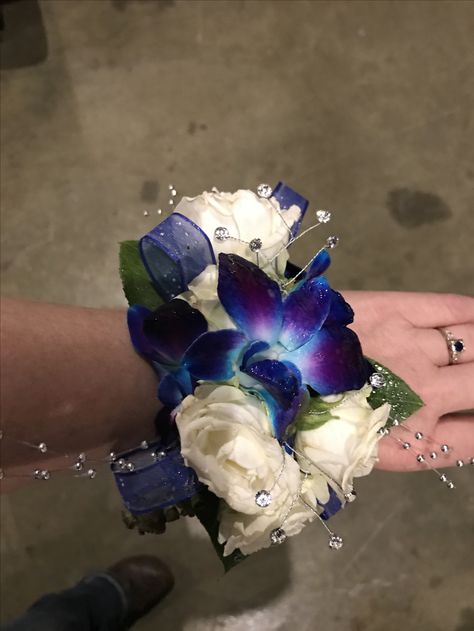 White roses blue dendrobium orchid with crystal embellishments. Wrist corsage. White Orchid Corsage, White Rose Corsage, Blue Orchid Wedding, Orchid Corsage, Blue Dendrobium Orchids, Orchid Corsages, Prom Corsage And Boutonniere, Dendrobium Orchid, Silver Wedding Cake