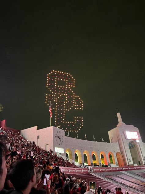 SC. Southern California. LA Coliseum. USC football game. Night. Drones. College football stadium Usc Gould Law, Usc Football Aesthetic, Usc University Aesthetic, Usc College Aesthetic, Usc Aesthetic Wallpaper, Usc Aesthetic Campus, University Of Southern California Aesthetic, Usc Grad Cap, Usc Aesthetic