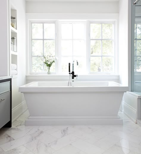 Sink Into 10 Beautiful Bathrooms With Standalone Tubs - House & Home Chevron Tiles Floor, Bubbles Chandelier, Quatrefoil Mirror, Oval Bathtub, Simple Bathroom Remodel, Stand Alone Tub, Master Bath Ideas, Bad Inspiration, Transitional Bathroom